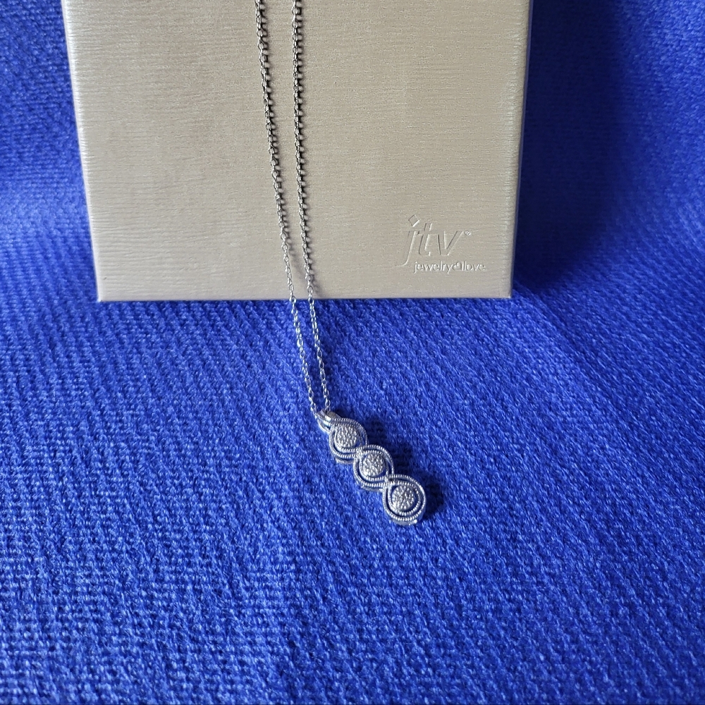 Round drop white diamond rhodium 925 sterling silver pendant with chain.